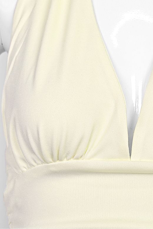 Woman wearing a figure flattering Aby Halter Top - Butter Yellow BODYCON COLLECTION Pty Ltd