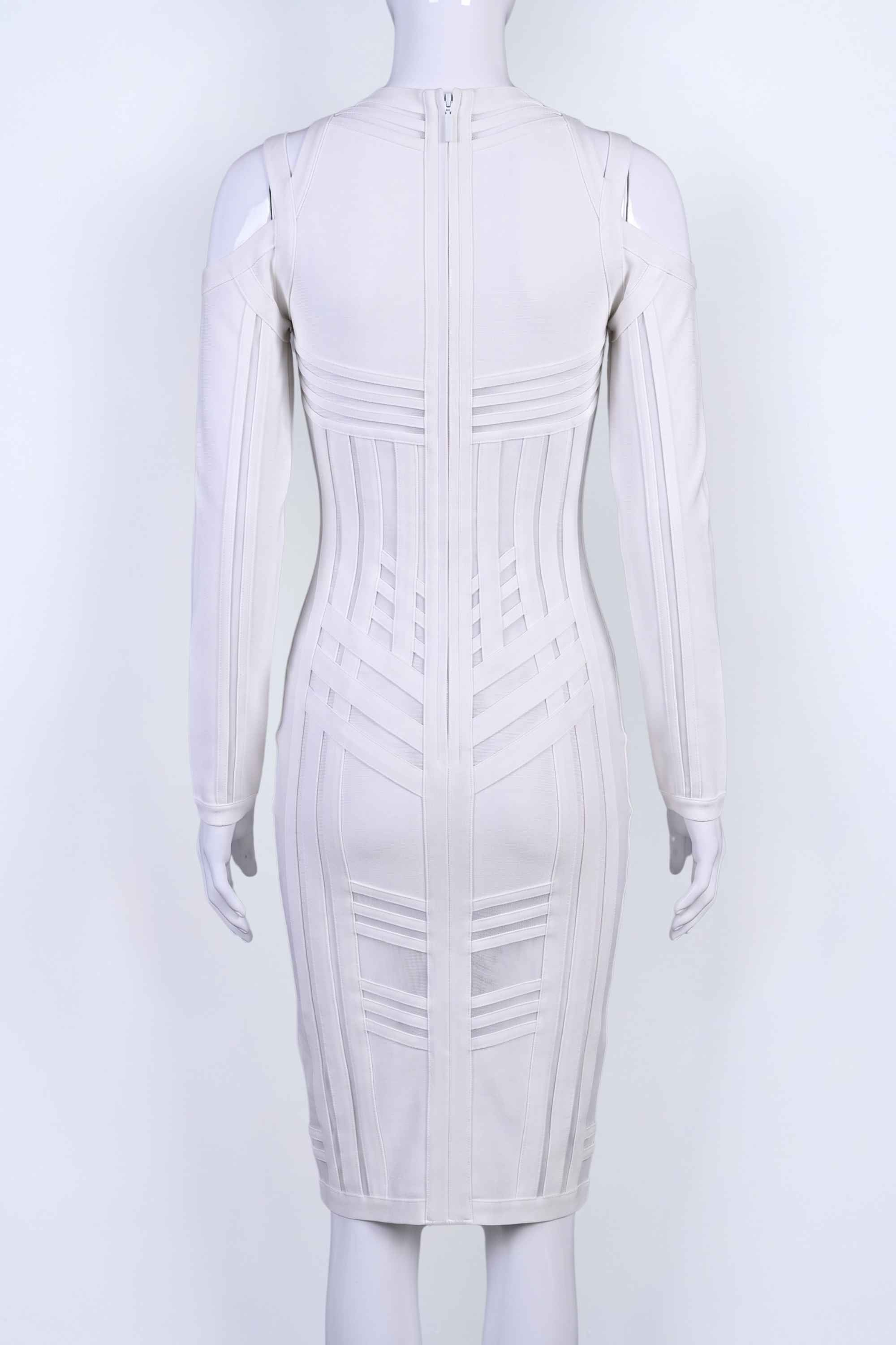 Woman wearing a figure flattering Amelia Long Sleeve Bandage Dress - Pearl White BODYCON COLLECTION