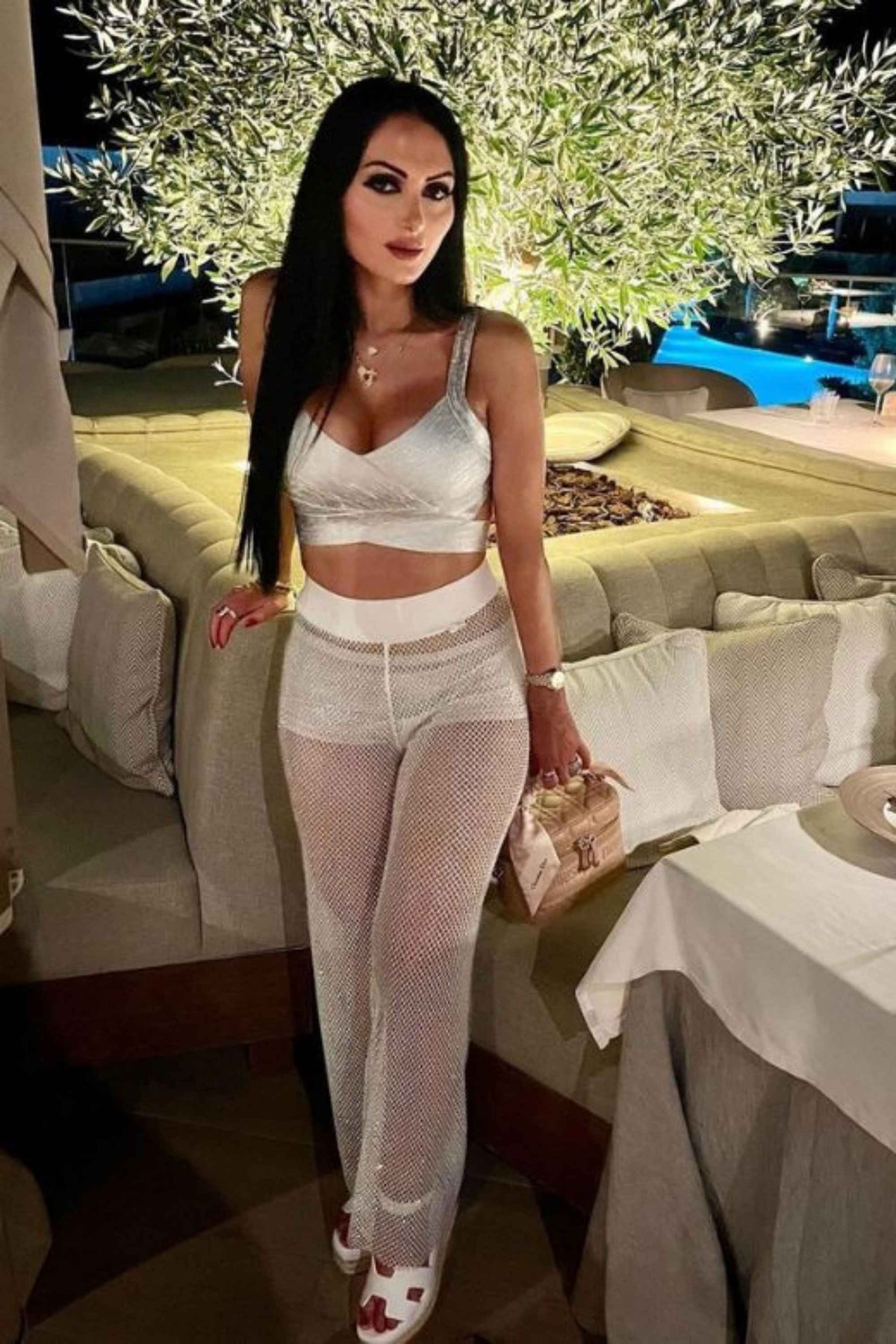 Woman wearing a figure flattering Ang Bandage Crop Top - Gold BODYCON COLLECTION