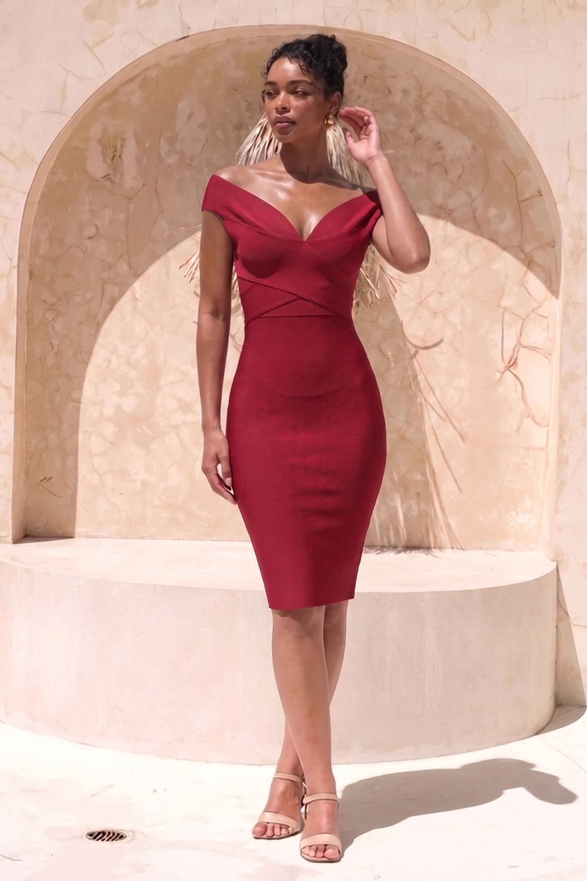 Woman wearing a figure flattering Ash Bandage Dress - Red Wine Bodycon Collection