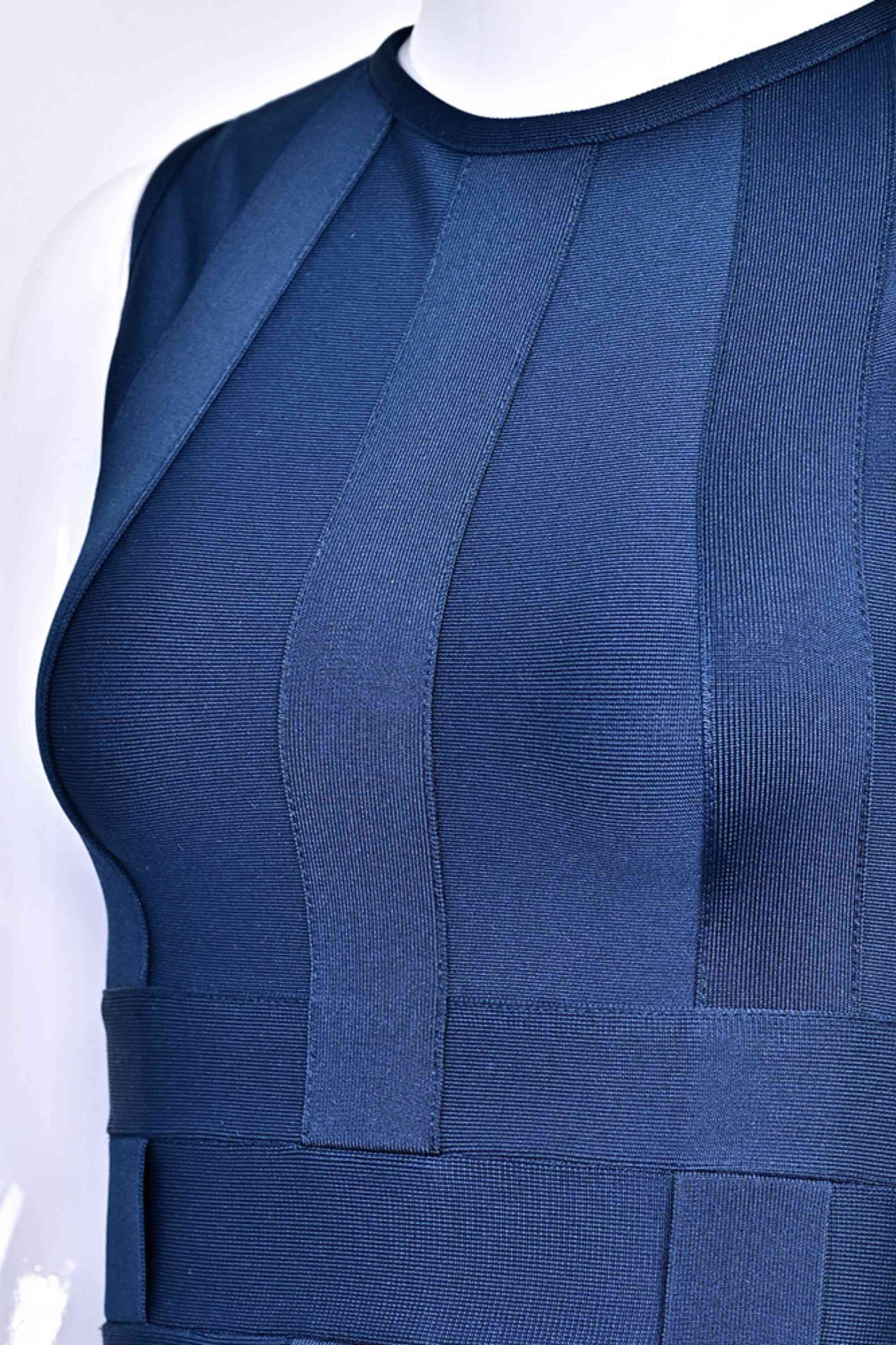 Woman wearing a figure flattering Aurora Bandage Dress - Navy Blue BODYCON COLLECTION Pty Ltd