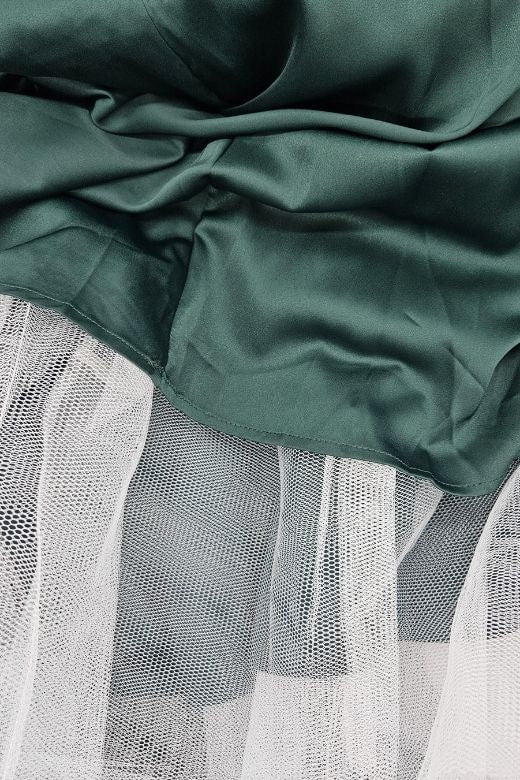 Woman wearing a figure flattering Mavis Midi Dress - Emerald Green (Sale) BODYCON COLLECTION