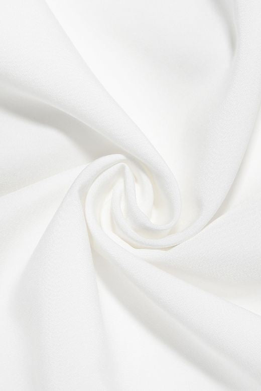 Woman wearing a figure flattering Austen Bodycon Midi Dress - Pearl White BODYCON COLLECTION