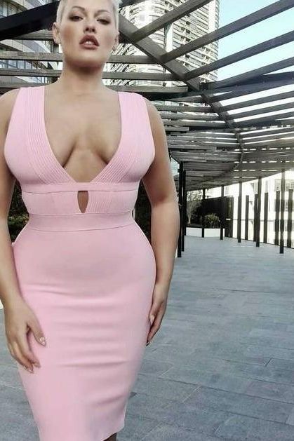 Woman wearing a figure flattering Bay Bandage Dress - Classic Black Bodycon Collection