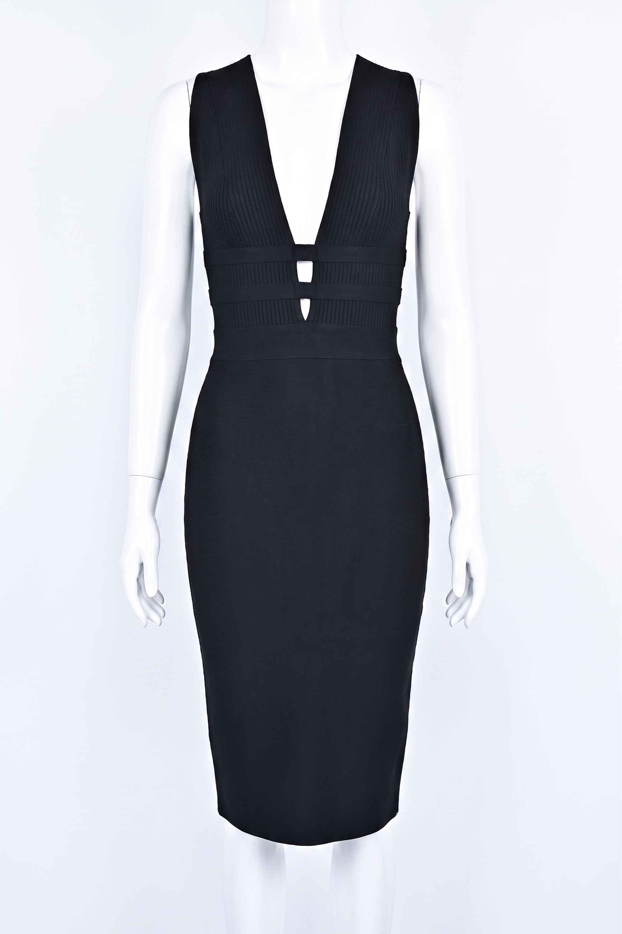 Woman wearing a figure flattering Bay Bandage Dress - Classic Black Bodycon Collection
