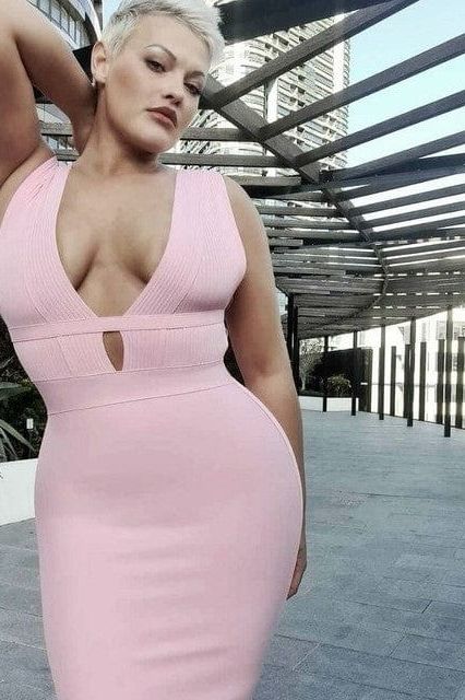 Woman wearing a figure flattering  Bay Bandage Dress - Nude Bodycon Collection