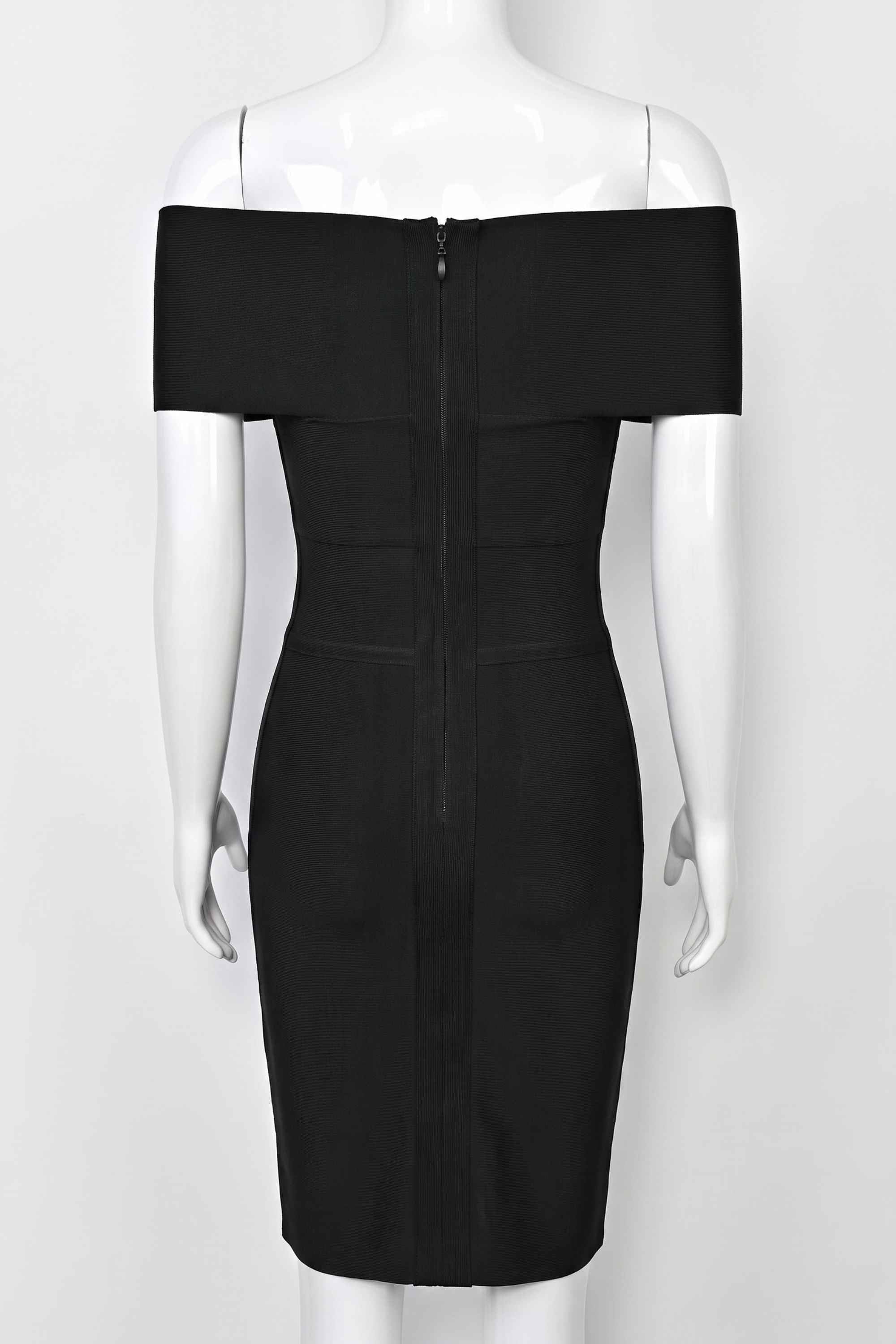 Woman wearing a figure flattering Bea Bandage Dress - Classic Black Bodycon Collection