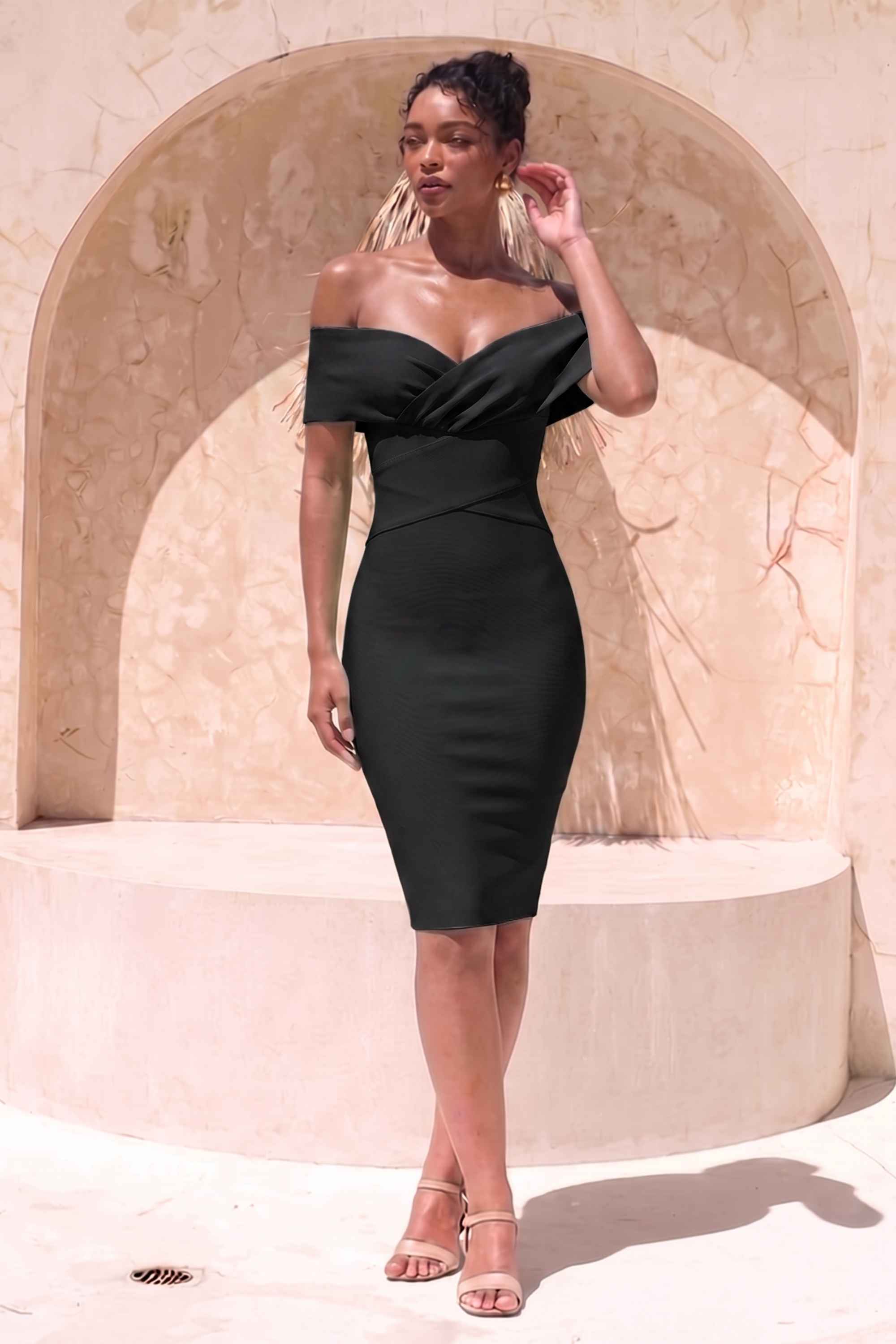 Woman wearing a figure flattering Bea Bandage Dress - Classic Black Bodycon Collection