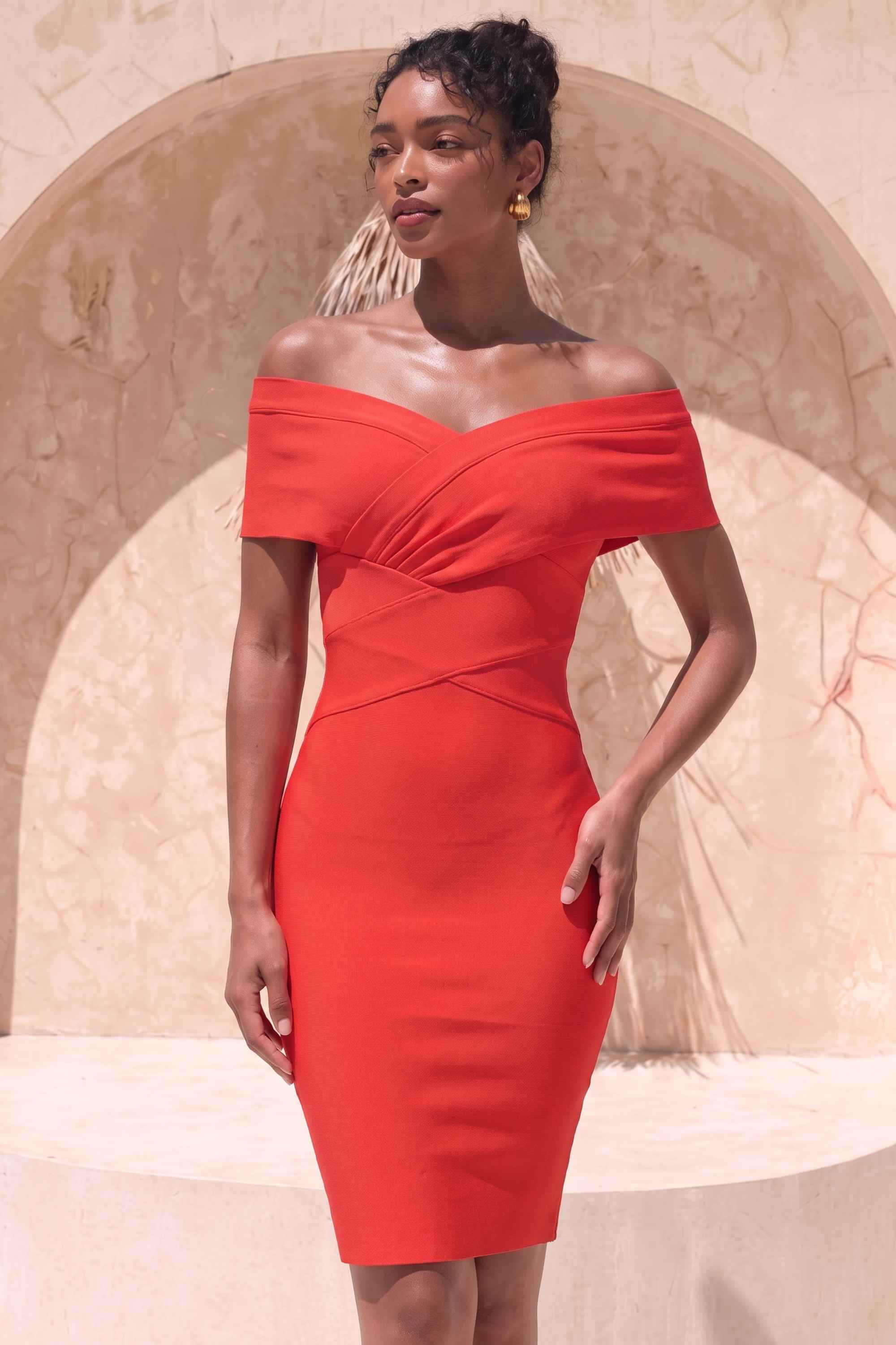 Woman wearing a figure flattering Bea Bandage Dress - Lipstick Red Bodycon Collection