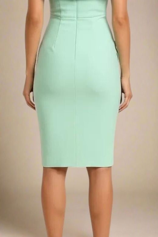 Woman wearing a figure flattering Bea Bandage Dress - Mint Green Bodycon Collection