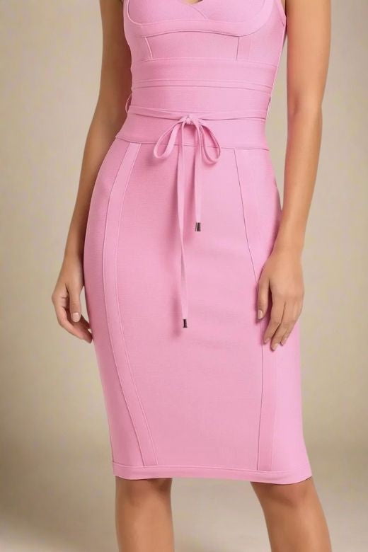 Woman wearing a figure flattering Bek Bandage Dress - Blush Pink Bodycon Collection