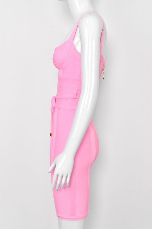 Woman wearing a figure flattering Bek Bandage Dress - Blush Pink Bodycon Collection