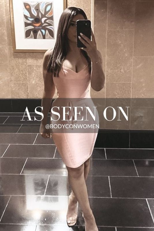 Woman wearing a figure flattering Bek Bandage Dress - Blush Pink Bodycon Collection