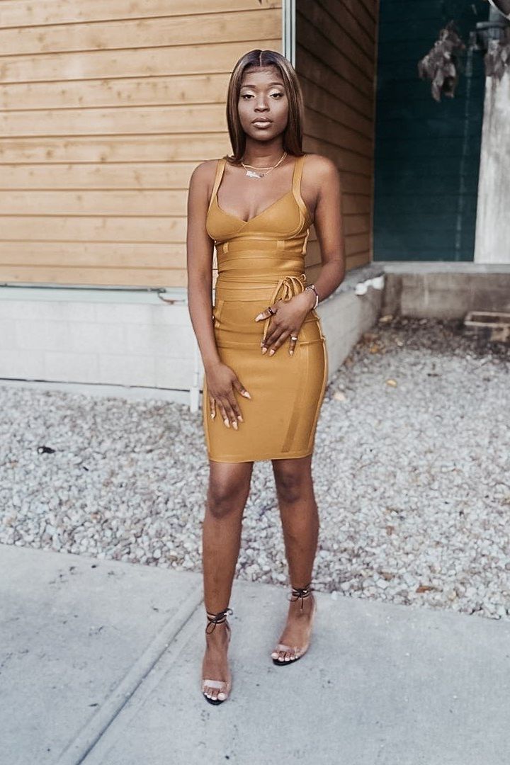 Woman wearing a figure flattering  Bek Bandage Dress - Classic Black Bodycon Collection