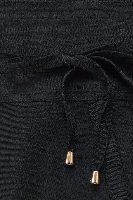 Woman wearing a figure flattering Bek Bandage Dress - Classic Black Bodycon Collection