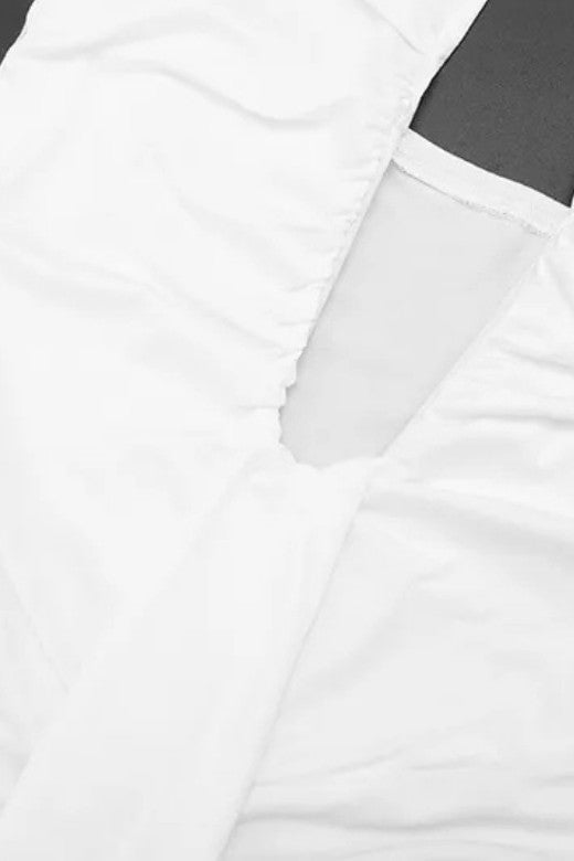 Woman wearing a figure flattering Bella Bodycon Wrap Maxi Dress - White Pearl BODYCON COLLECTION Pty Ltd