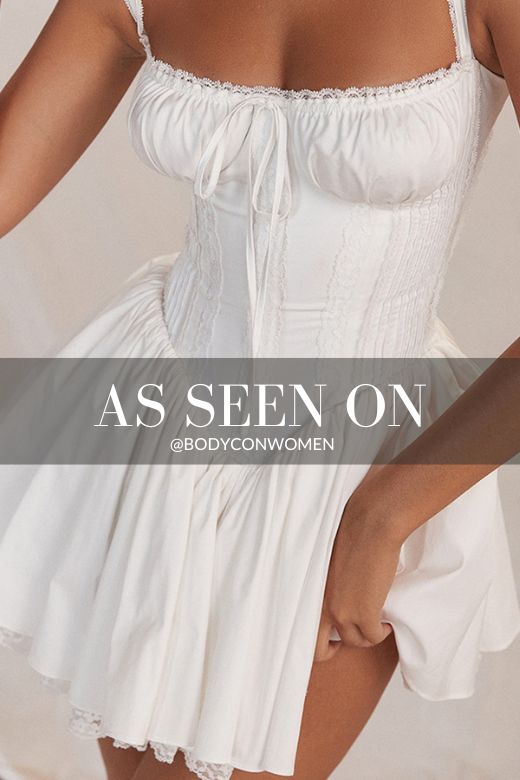 Woman wearing a figure flattering Belle Bodycon Mini Dress - Pearl White BODYCON COLLECTION