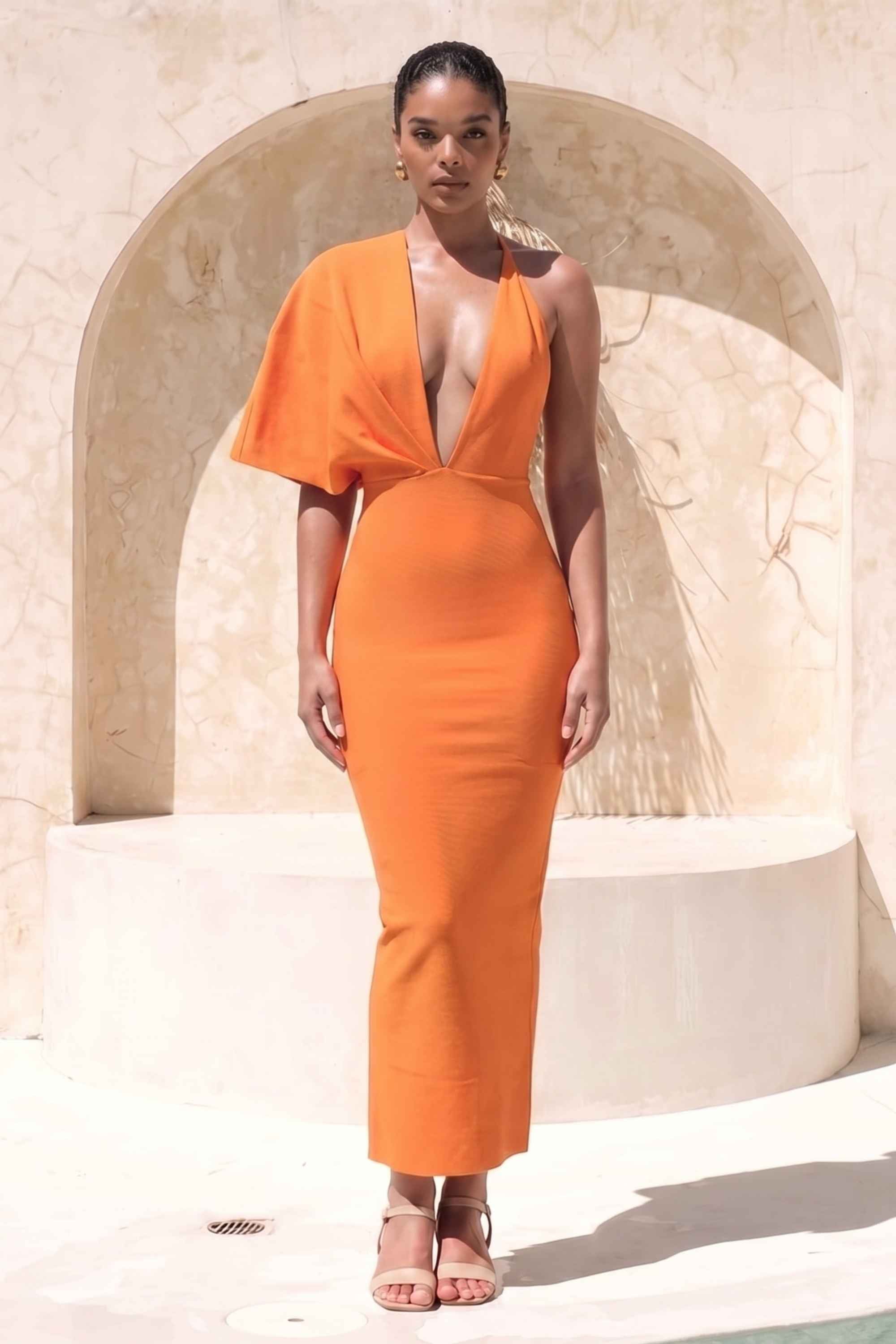 Woman wearing a figure flattering Blake Bandage Maxi Dress - Apricot Orange BODYCON COLLECTION