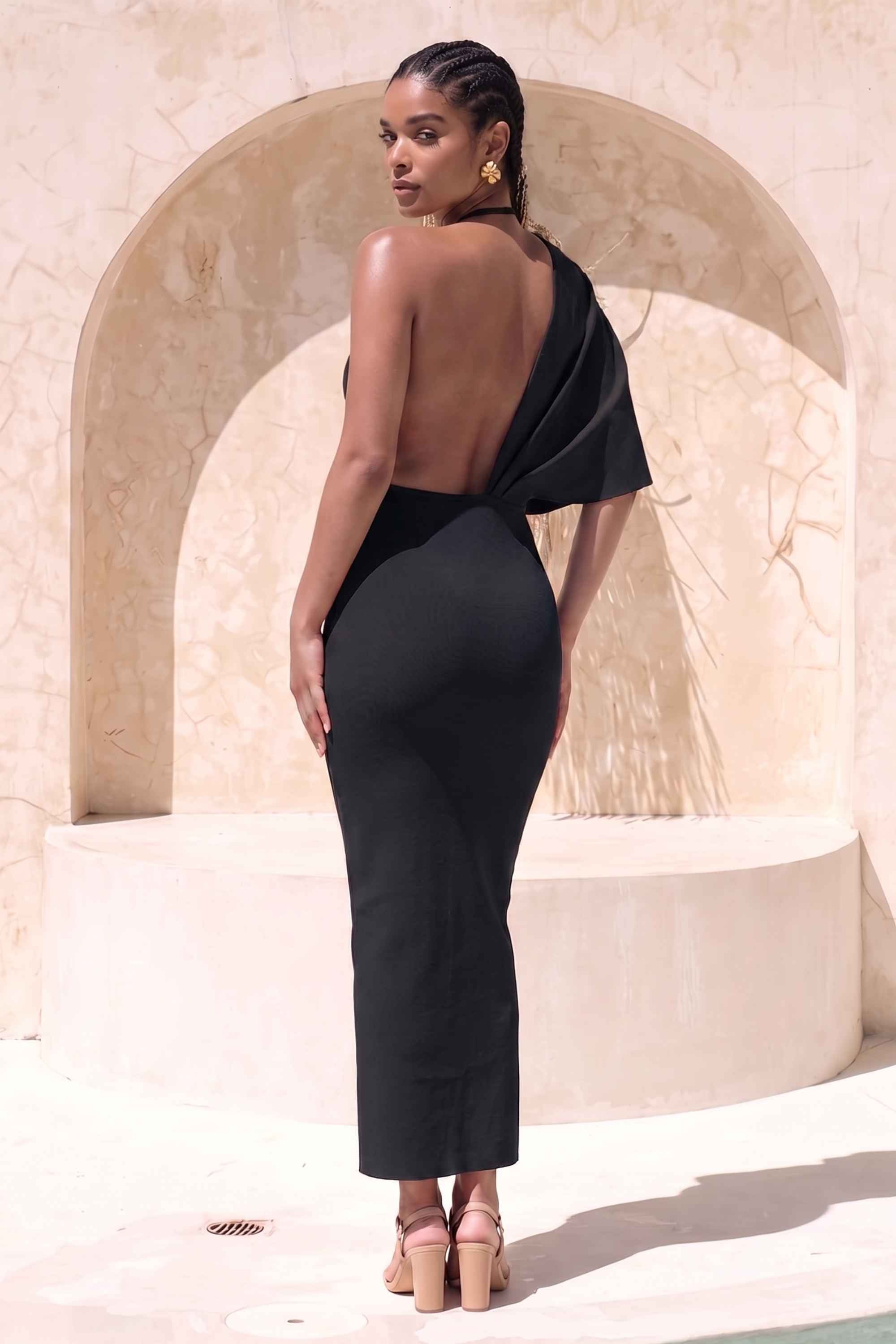 Woman wearing a figure flattering Blake Bandage Maxi Dress - Classic Black BODYCON COLLECTION