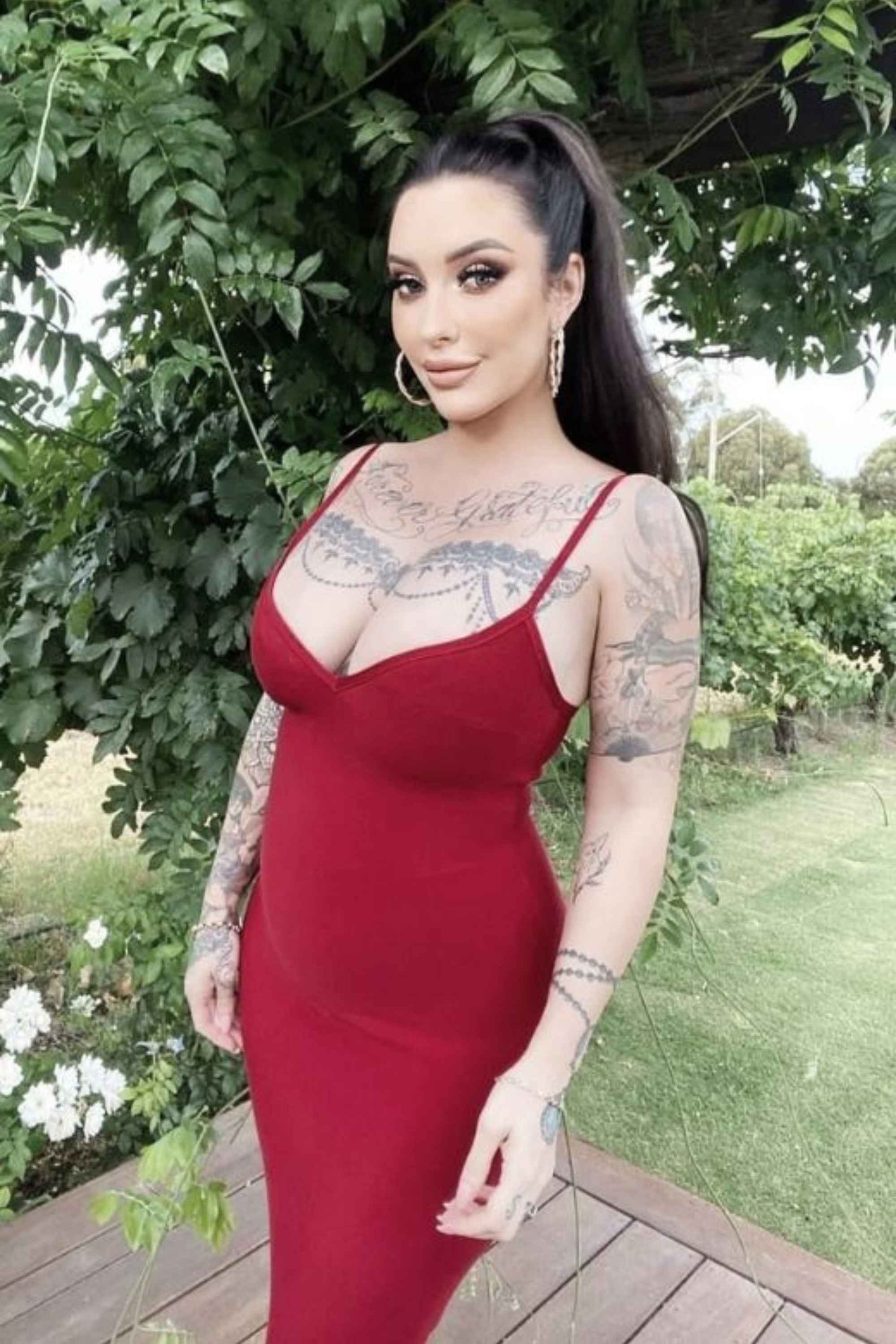 Woman wearing a figure flattering Blanche Bandage Midi Dress - Lipstick Red BODYCON COLLECTION