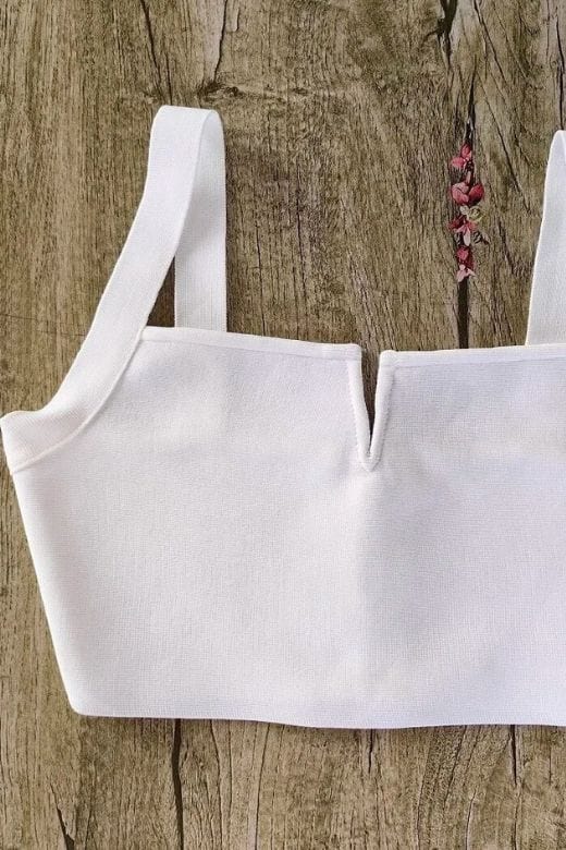 Woman wearing a figure flattering Brooke Bandage Crop Top - Pearl White BODYCON COLLECTION