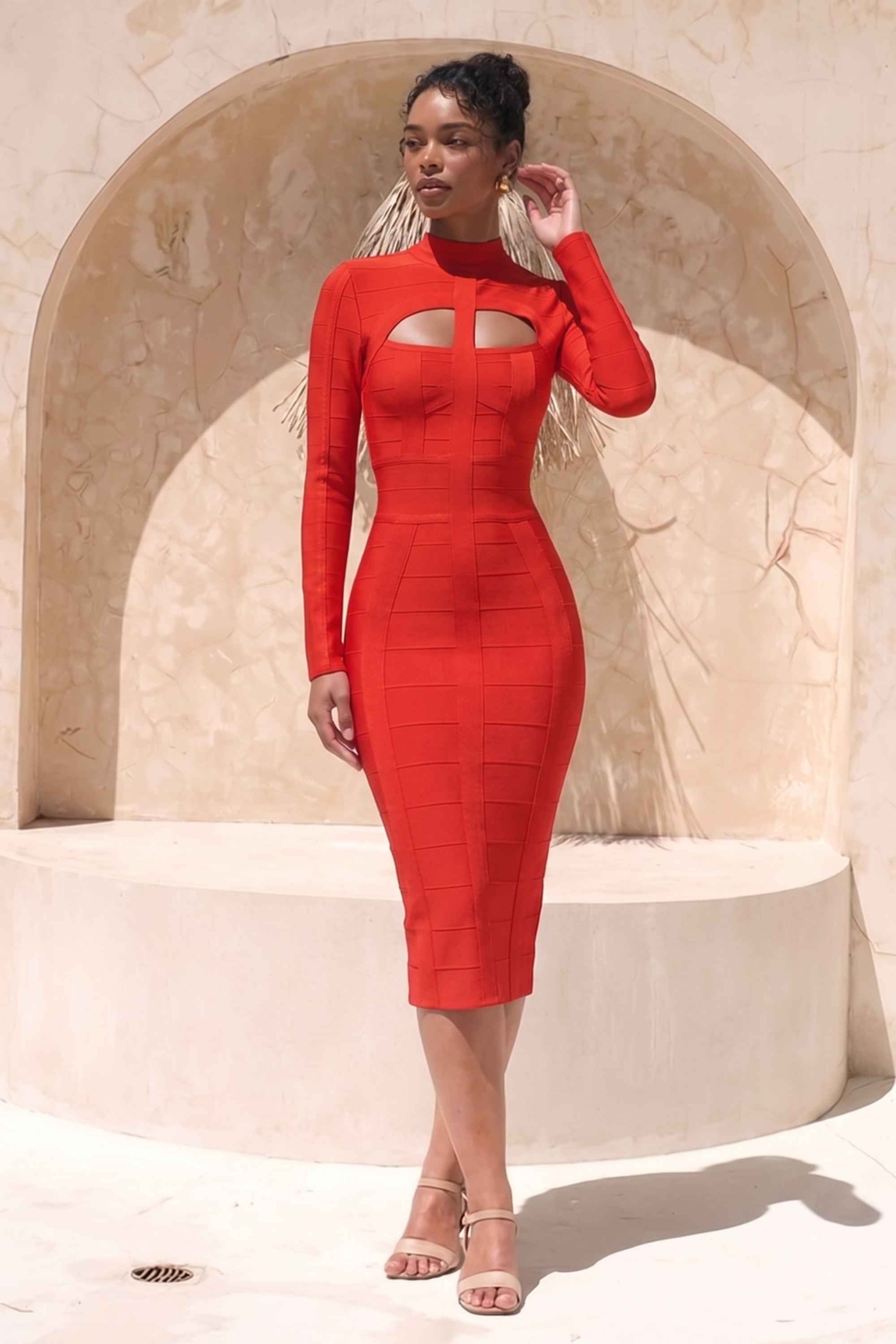 Woman wearing a figure flattering Brooke Long Sleeve Bandage Dress - Lipstick Red BODYCON COLLECTION