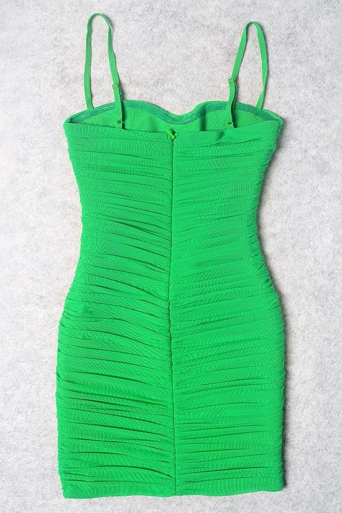 Woman wearing a figure flattering Cassie Bodycon Wrap Mini Dress - Emerald Green BODYCON COLLECTION