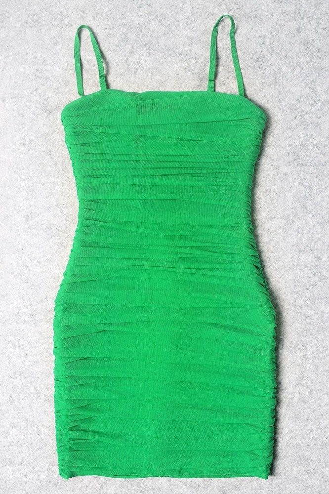 Woman wearing a figure flattering Cassie Bodycon Wrap Mini Dress - Emerald Green BODYCON COLLECTION