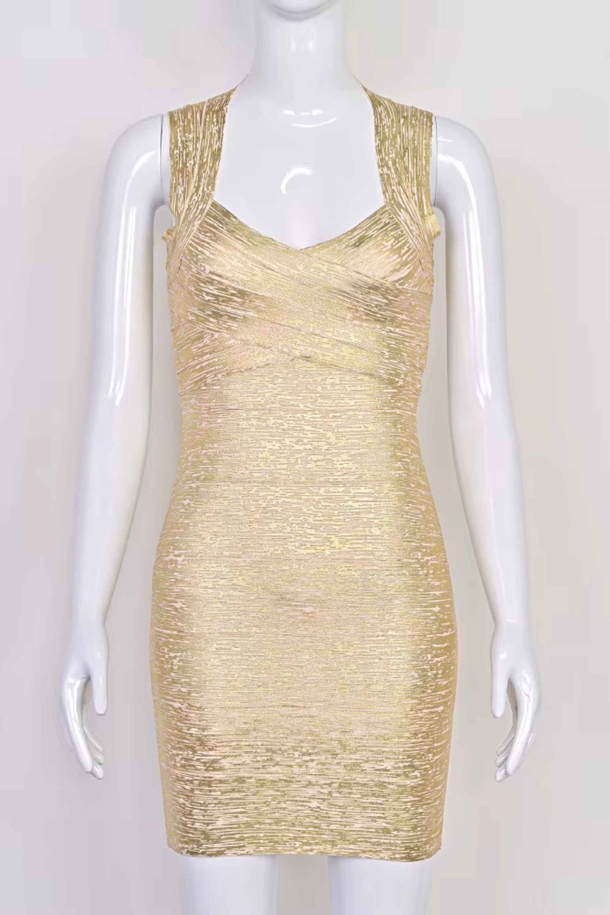 Woman wearing a figure flattering Ciara Bandage Mini Dress - Gold BODYCON COLLECTION