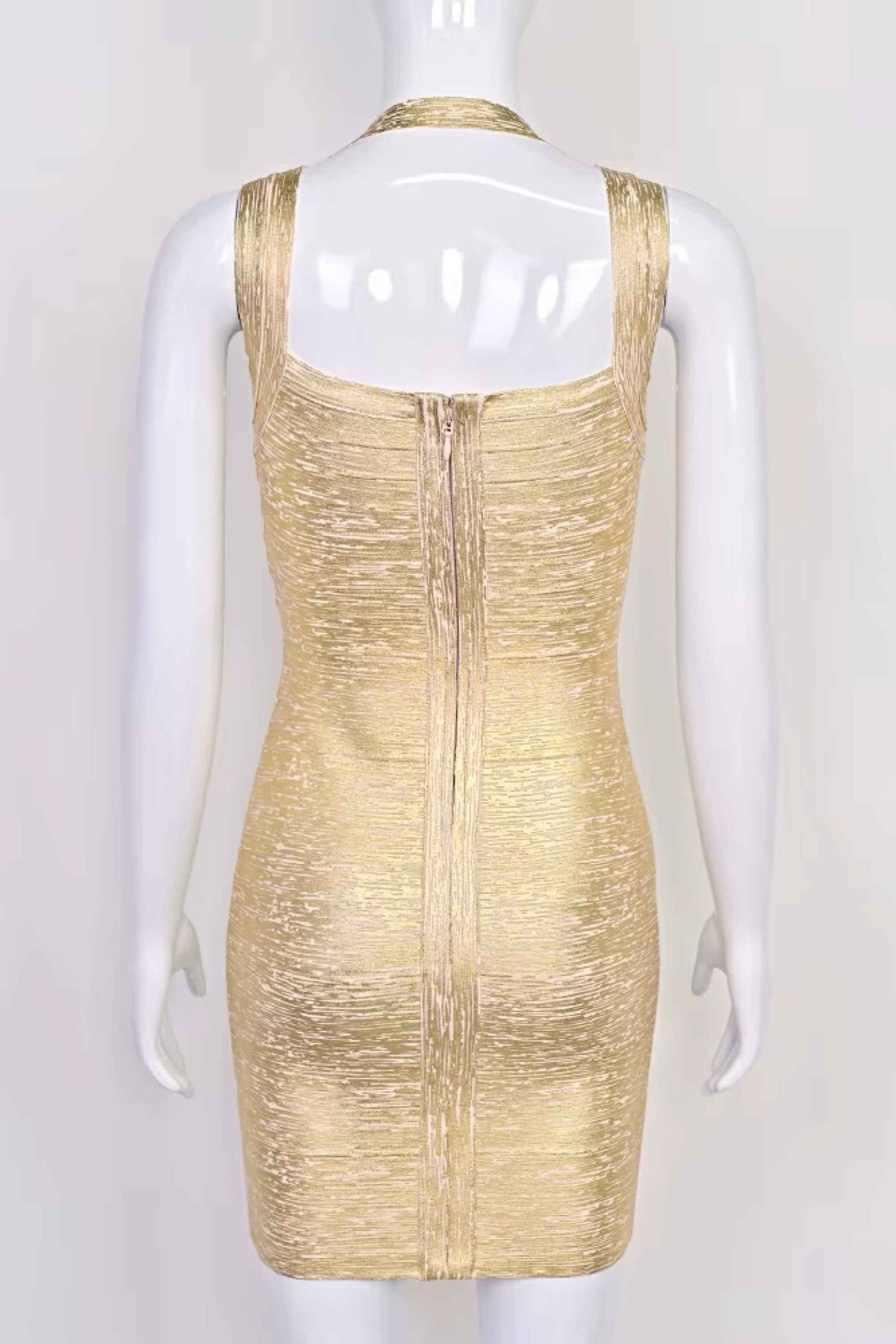 Woman wearing a figure flattering Ciara Bandage Mini Dress - Gold BODYCON COLLECTION