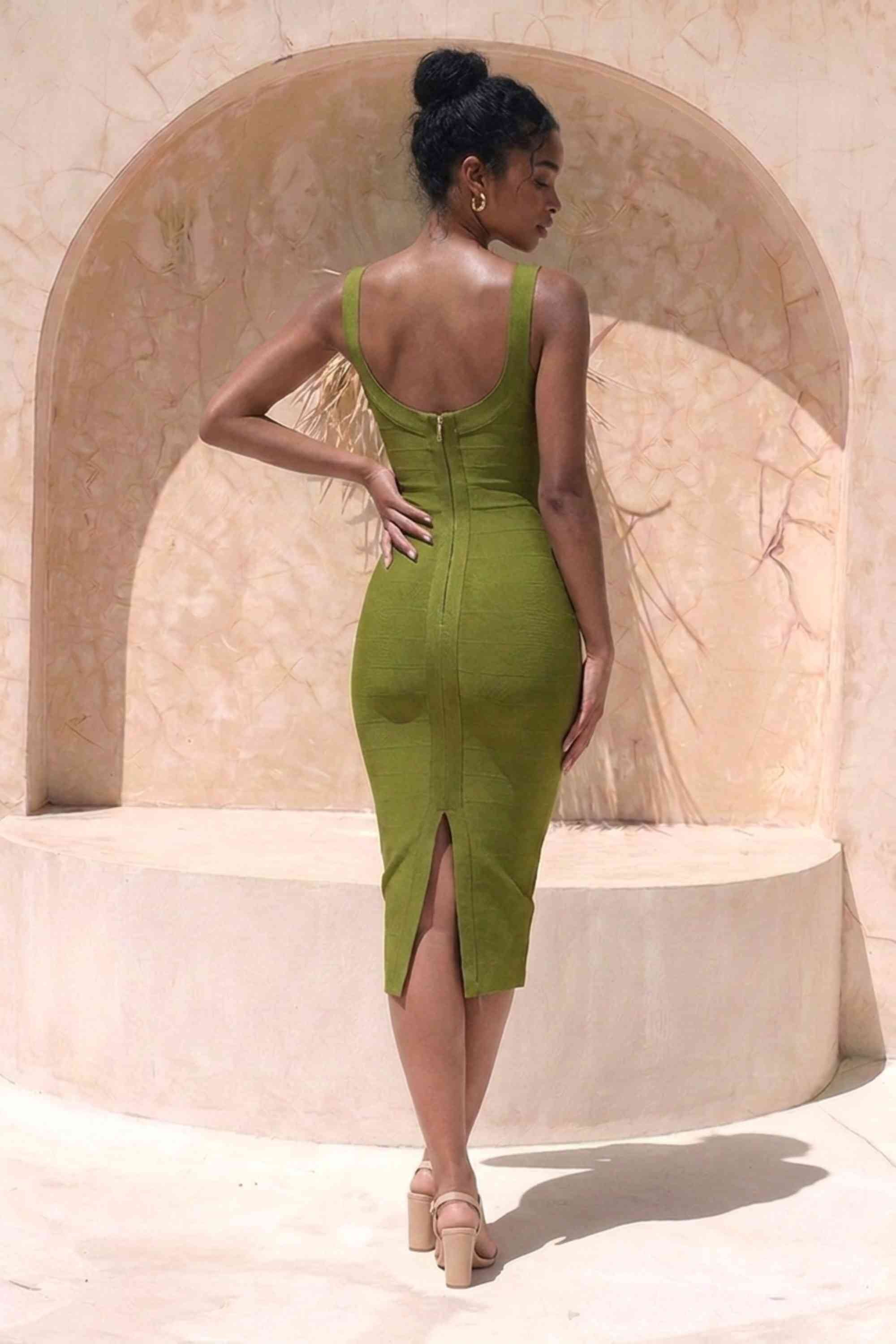 Woman wearing a figure flattering Cindy Bandage Midi Dress - Army Green BODYCON COLLECTION Pty Ltd