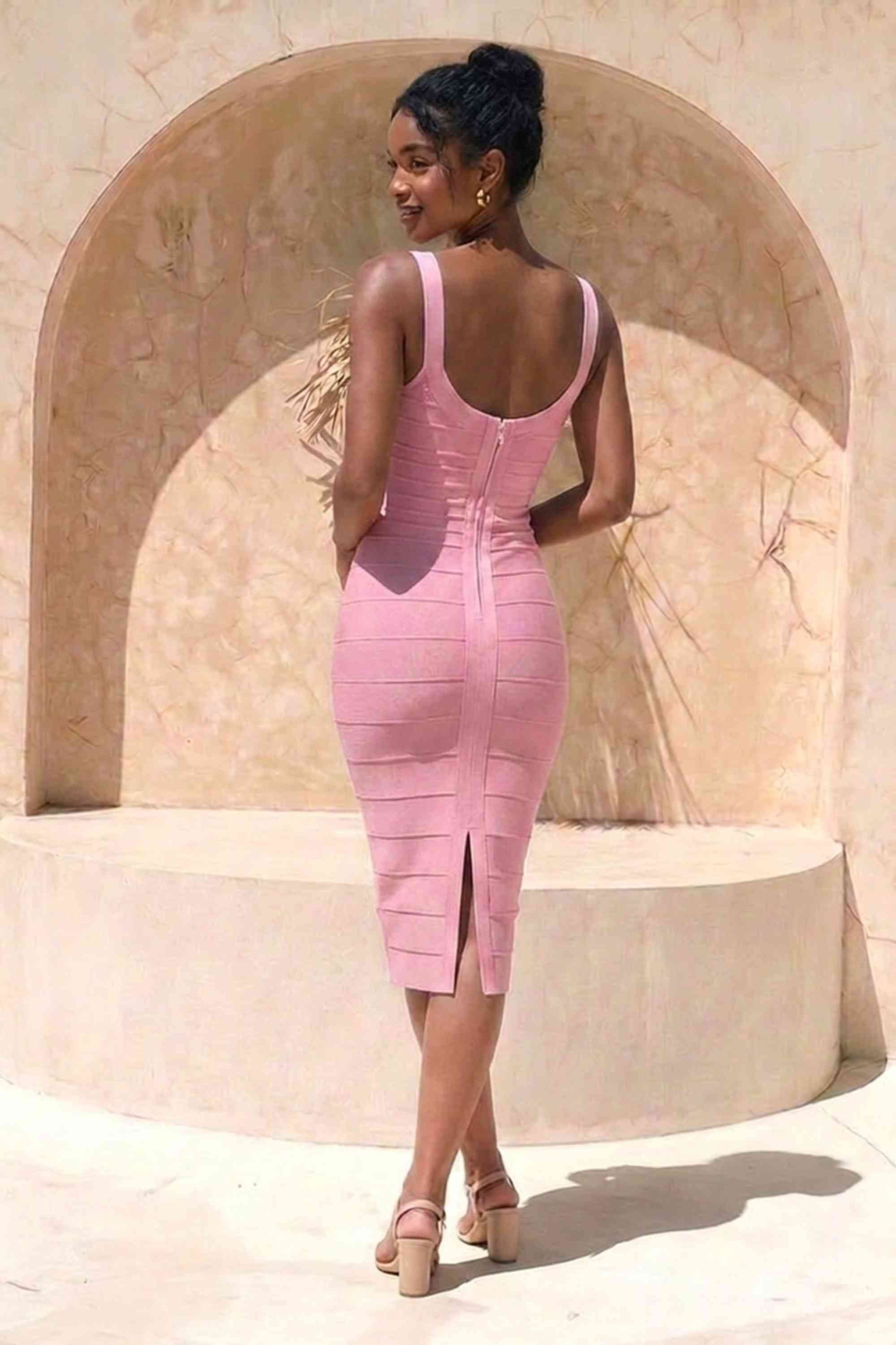 Woman wearing a figure flattering Cindy Bandage Midi Dress - Blush Pink BODYCON COLLECTION Pty Ltd