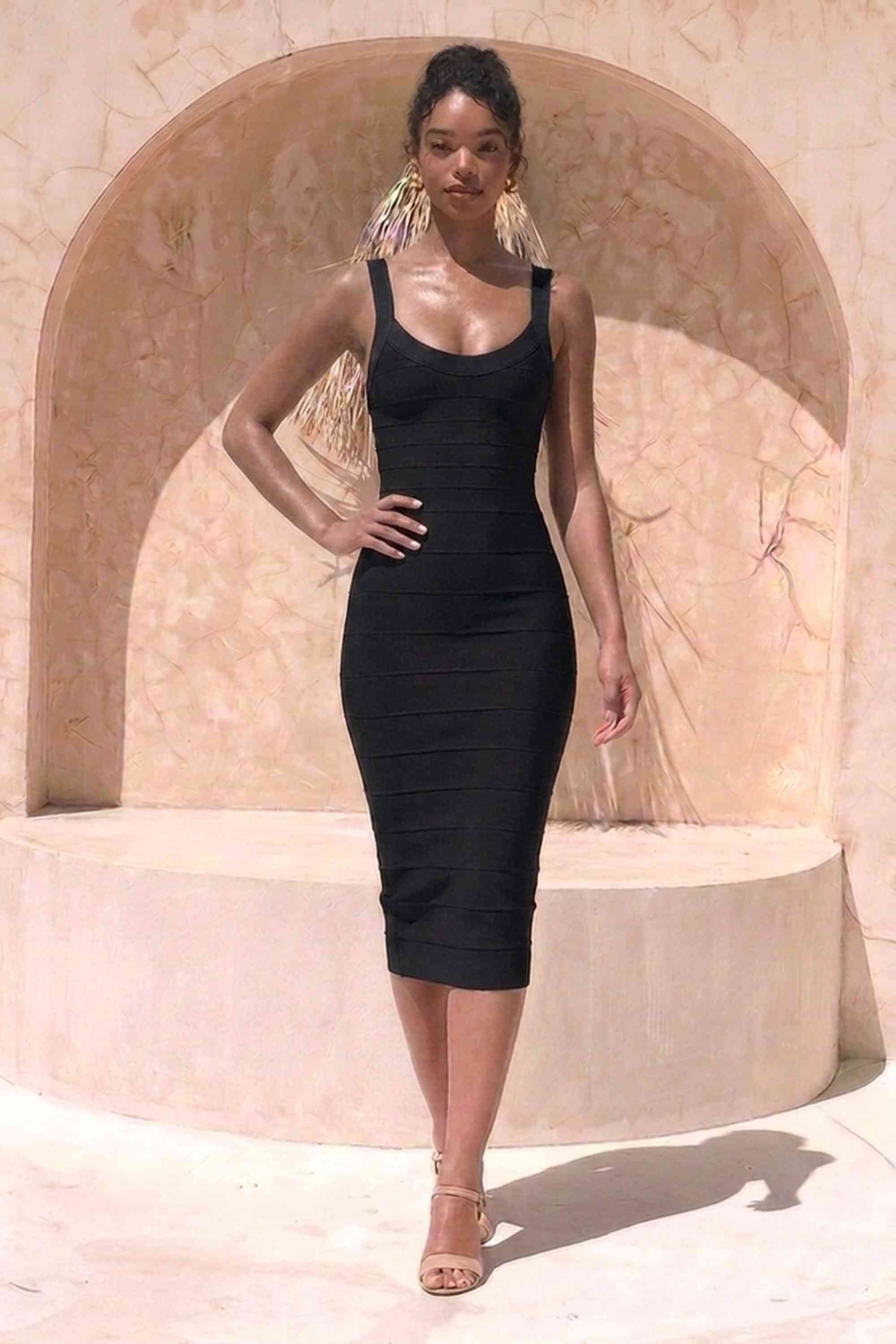 Woman wearing a figure flattering Cindy Bandage Midi Dress - Classic Black BODYCON COLLECTION Pty Ltd