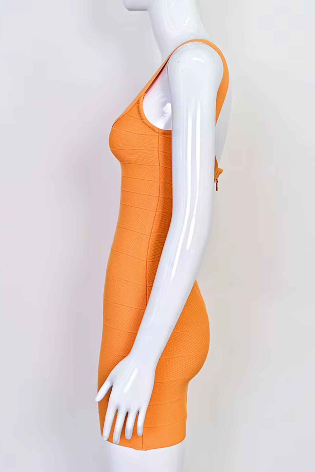 Woman wearing a figure flattering Cindy Bandage Mini Dress - Apricot Orange BODYCON COLLECTION Pty Ltd