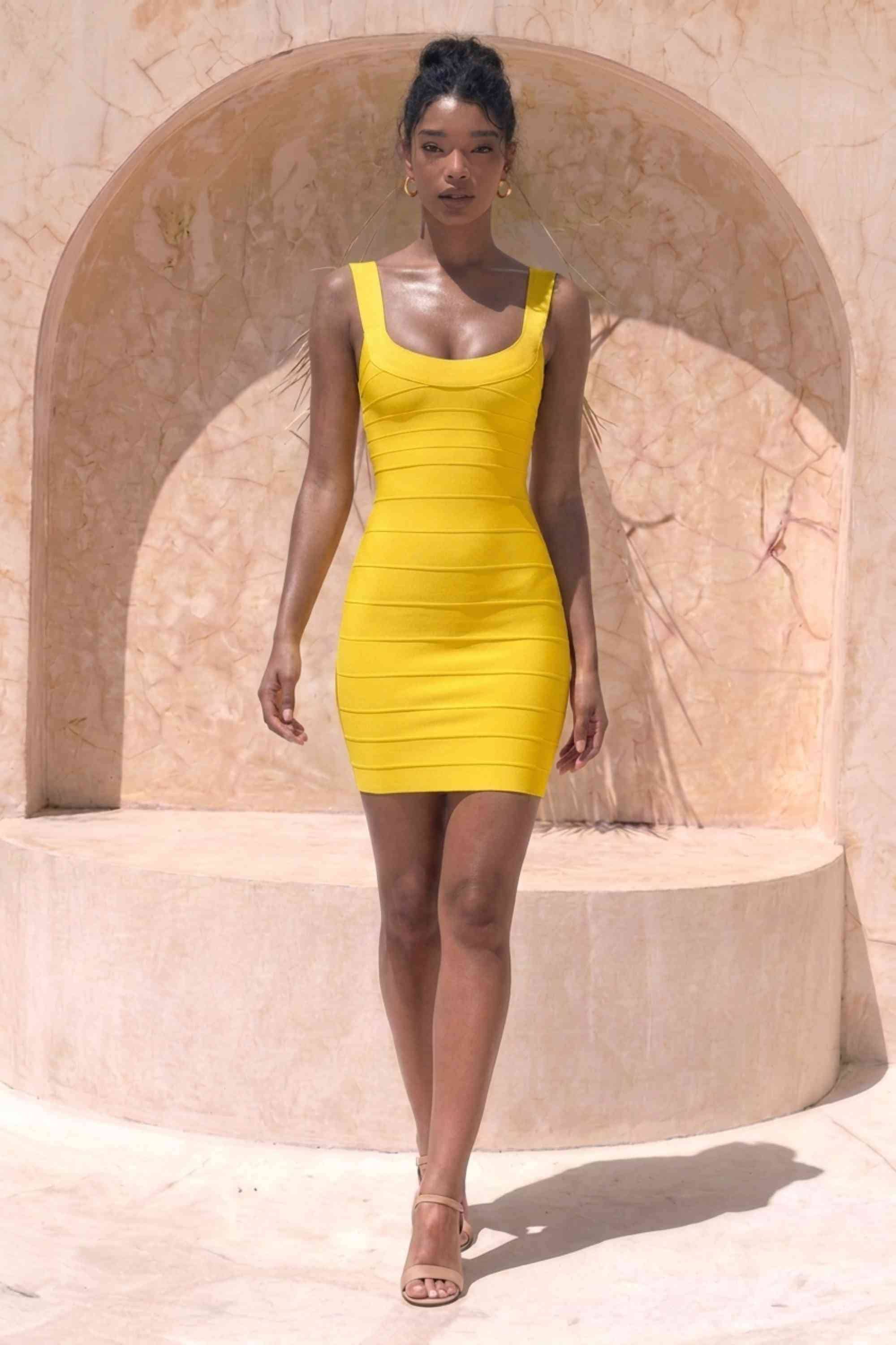Woman wearing a figure flattering Cindy Bandage Mini Dress - Mustard Yellow BODYCON COLLECTION Pty Ltd