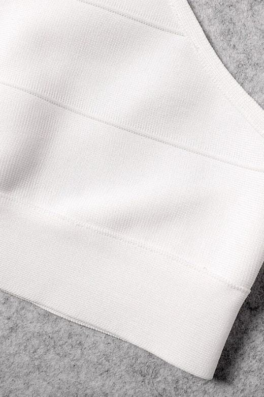 Woman wearing a figure flattering Elli Bandage Crop Top - Pearl White BODYCON COLLECTION