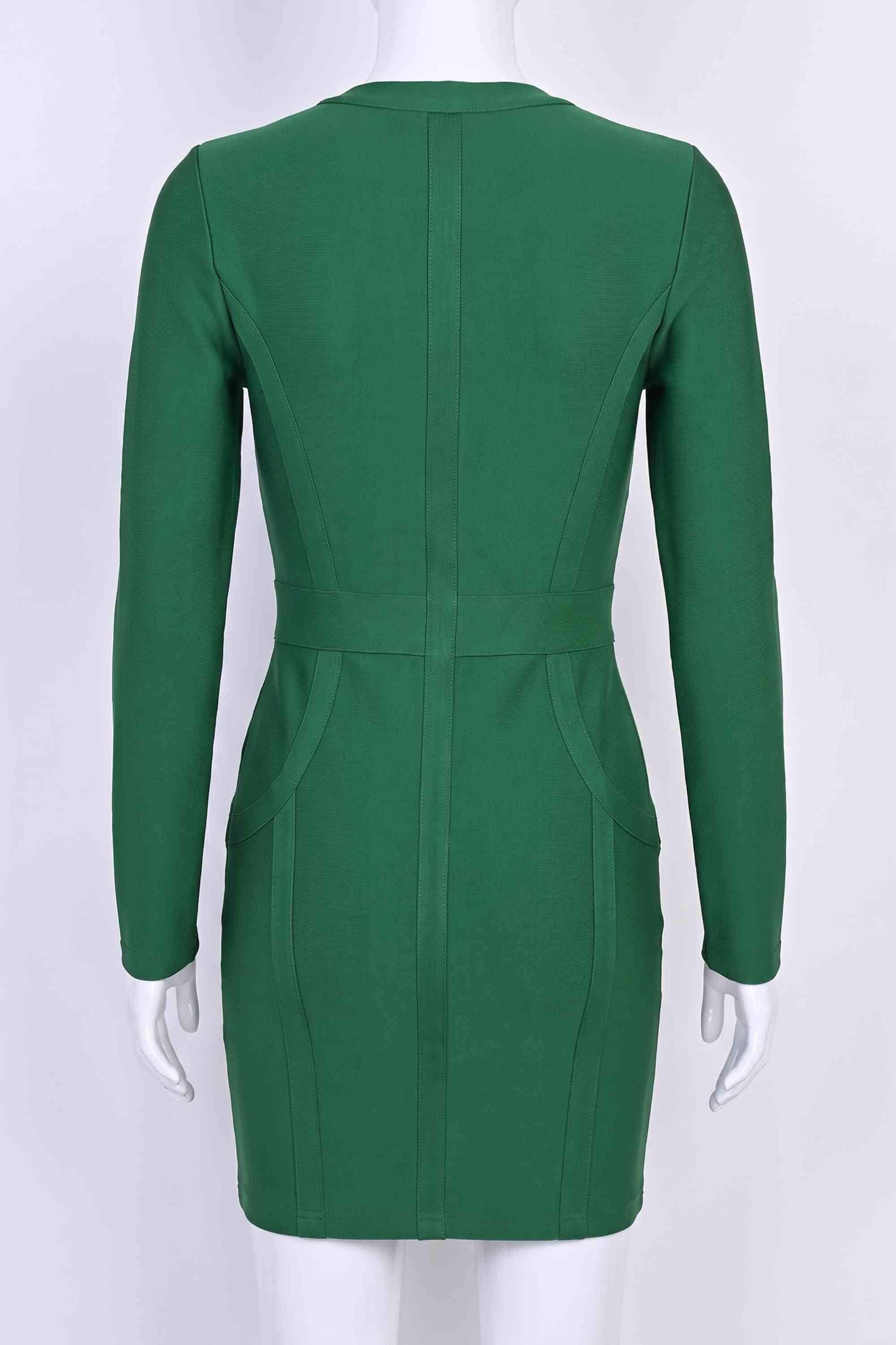 Woman wearing a figure flattering Eva Long Sleeve Bandage Mini Dress - Emerald Green BODYCON COLLECTION