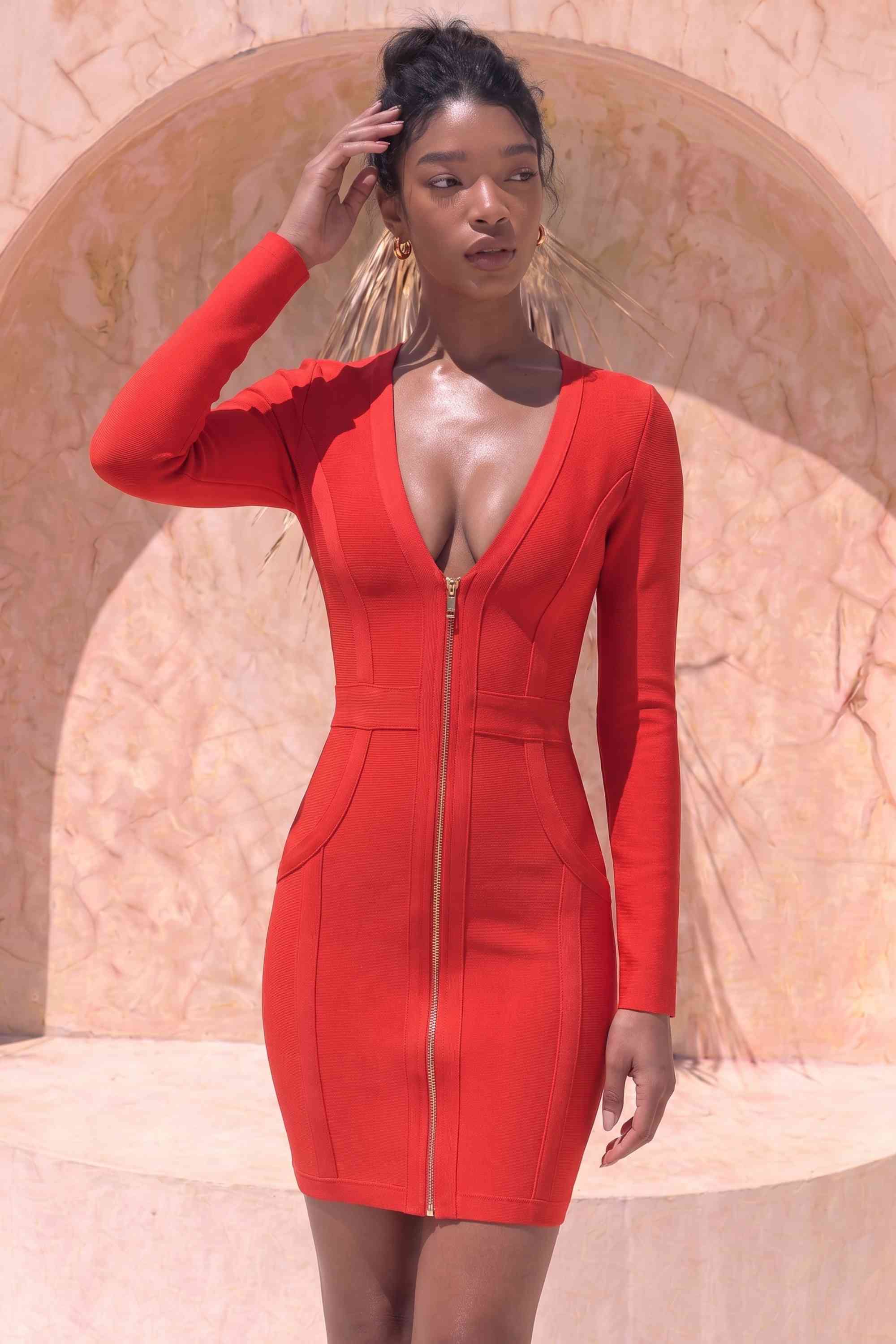 Woman wearing a figure flattering Eva Long Sleeve Bandage Mini Dress - Lipstick Red BODYCON COLLECTION