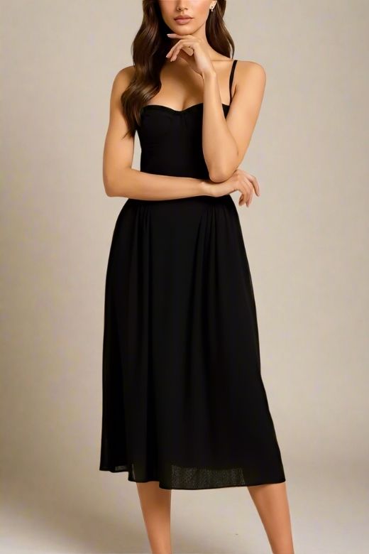 Woman wearing a figure flattering Everly Midi Dress - Classic Black BODYCON COLLECTION