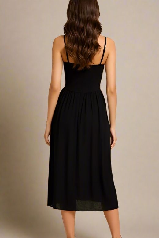 Woman wearing a figure flattering Everly Midi Dress - Classic Black BODYCON COLLECTION