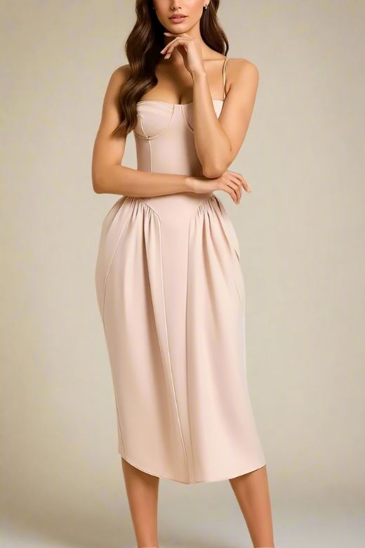 Woman wearing a figure flattering Everly Midi Dress - Peach BODYCON COLLECTION