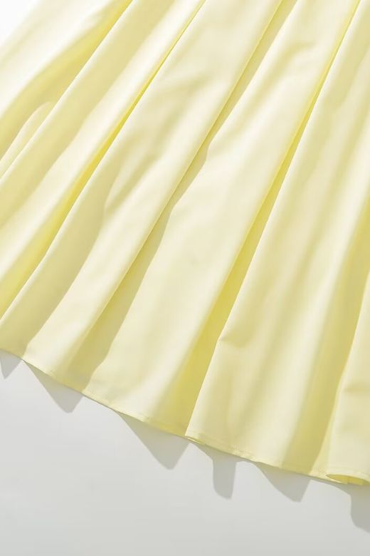 Woman wearing a figure flattering Gabbi Bodycon Midi Dress - Sun Yellow BODYCON COLLECTION