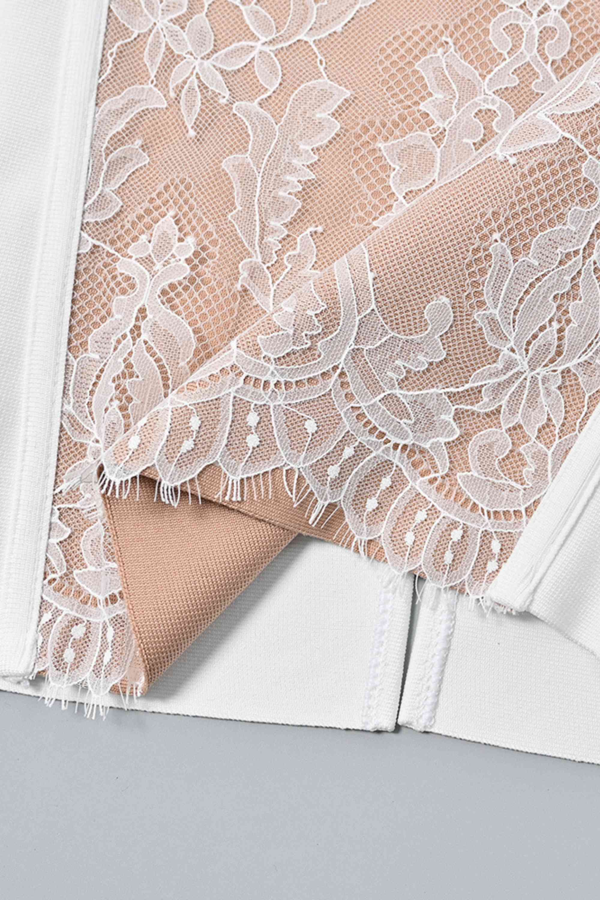 Woman wearing a figure flattering Genevieve Bodycon Lace Midi Dress - Pearl White BODYCON COLLECTION