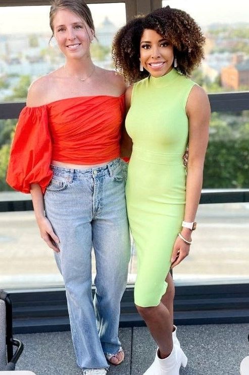 Woman wearing a figure flattering Grace Bandage Midi Dress - Classic Black Bodycon Collection