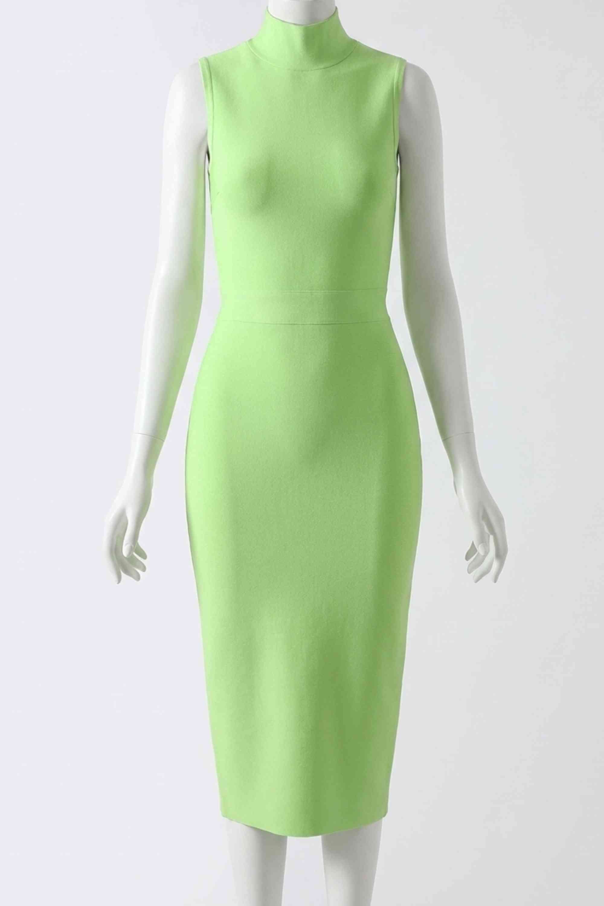Woman wearing a figure flattering Grace Bandage Midi Dress - Neon Green Bodycon Collection