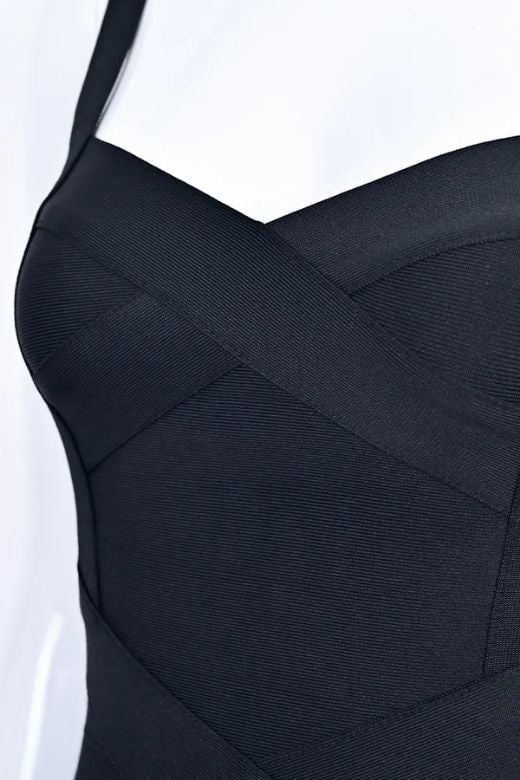 Woman wearing a figure flattering Heidi Bandage Midi Dress - Classic Black Bodycon Collection