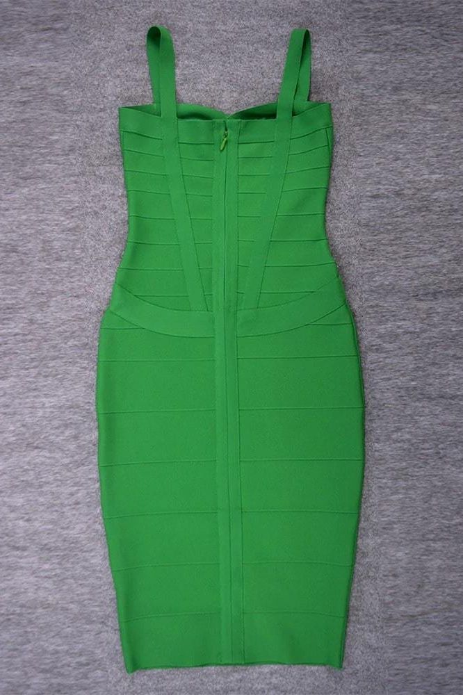 Woman wearing a figure flattering  Heidi Bandage Midi Dress - Emerald Green Bodycon Collection