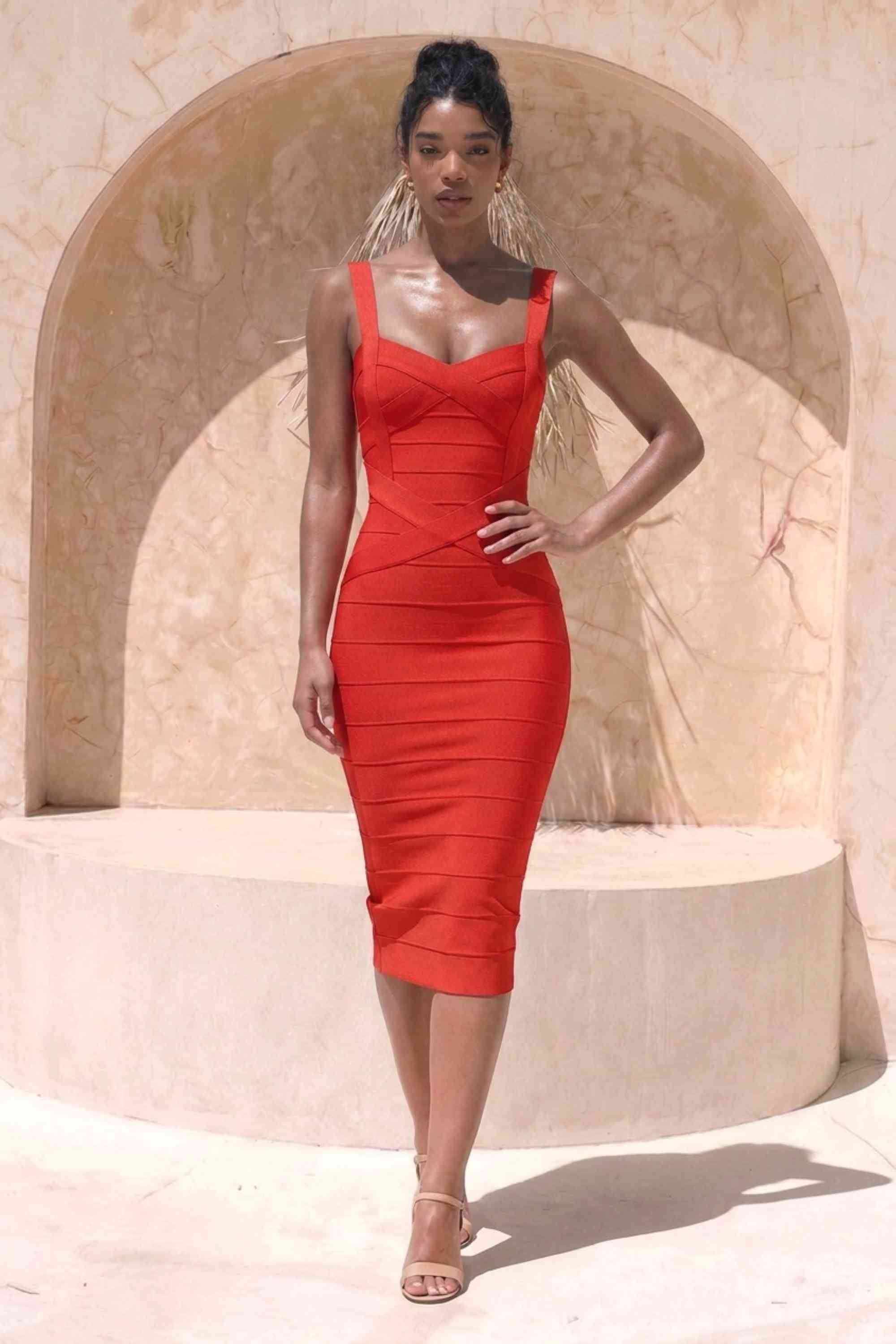 Woman wearing a figure flattering Heidi Bandage Midi Dress - Lipstick Red Bodycon Collection