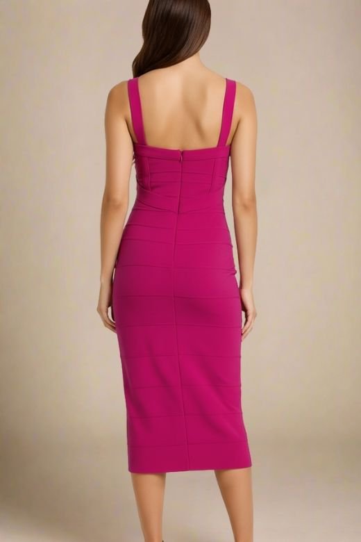 Woman wearing a figure flattering magenta pink party dress Heidi Bandage Midi Dress - Magenta Pink Bodycon Collection