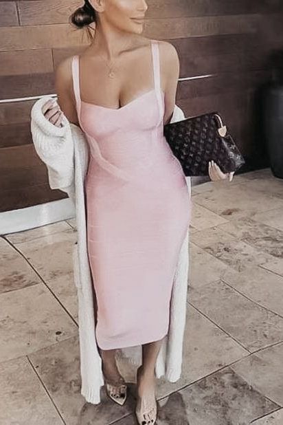 Woman wearing a figure flattering Heidi Bandage Midi Dress - Mustard Yellow Bodycon Collection